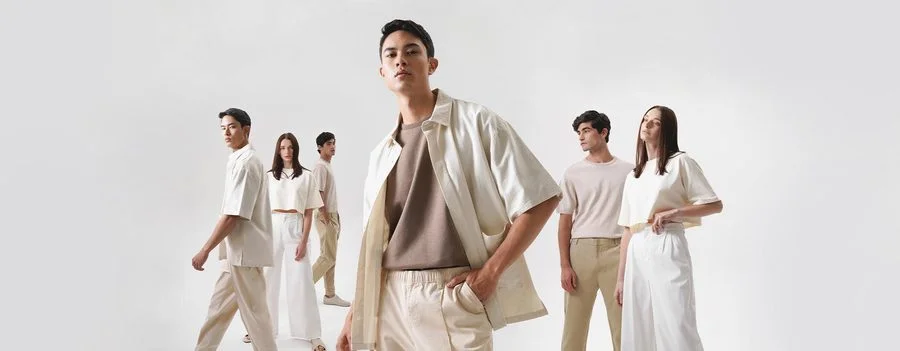 Minimal white cut and sew apparel collection on models