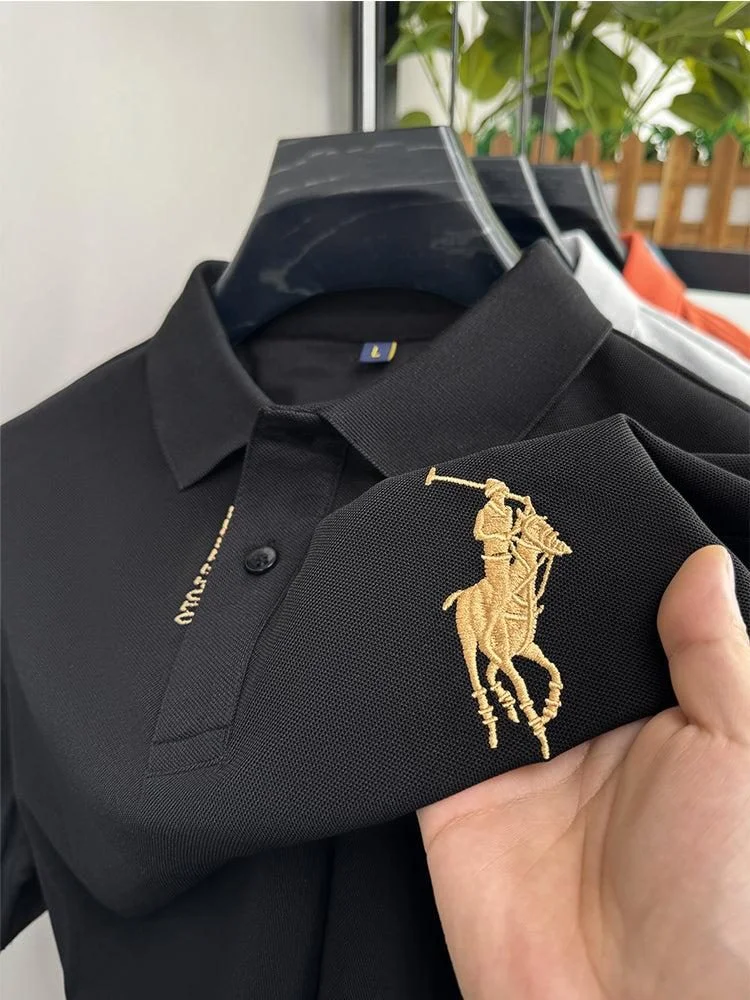 Embroidered logo detail on a technical polo shirt