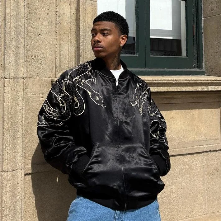 Embroidered bomber jacket worn as streetwear